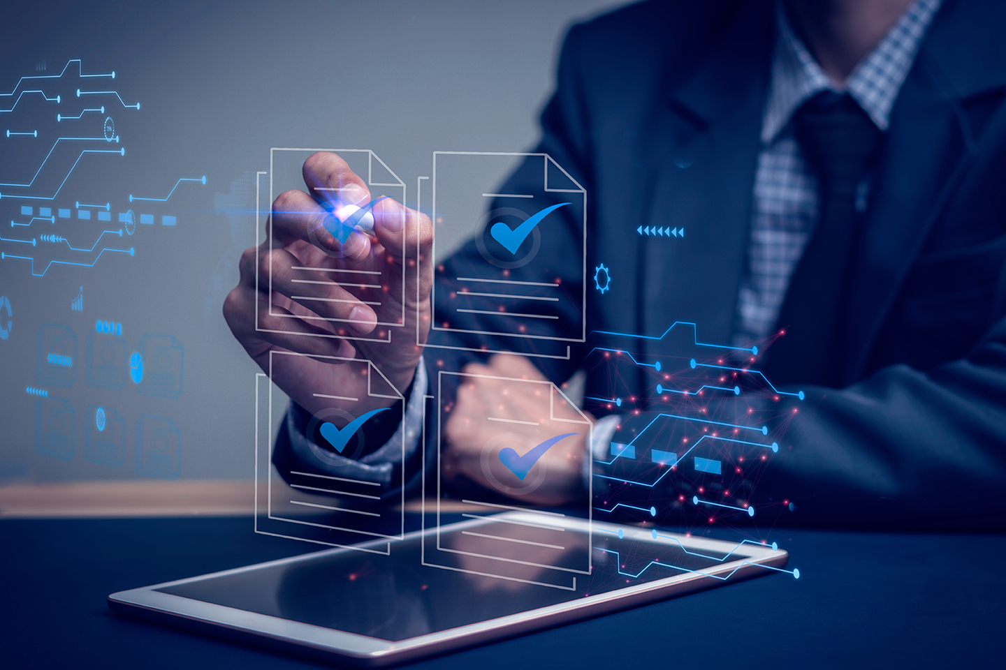 Businessman writes signing contract, designs, draws, or sketches projects through a tablet on the office desk. Hand concept stamp of approval on a public notarization certificate document electronic.