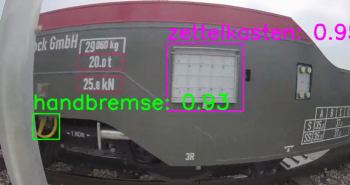 Nahaufnahmen eines Containertragwagens, auf dem die Handbremse und der Zettelkasten markiert sind. KI-Bilderkennung