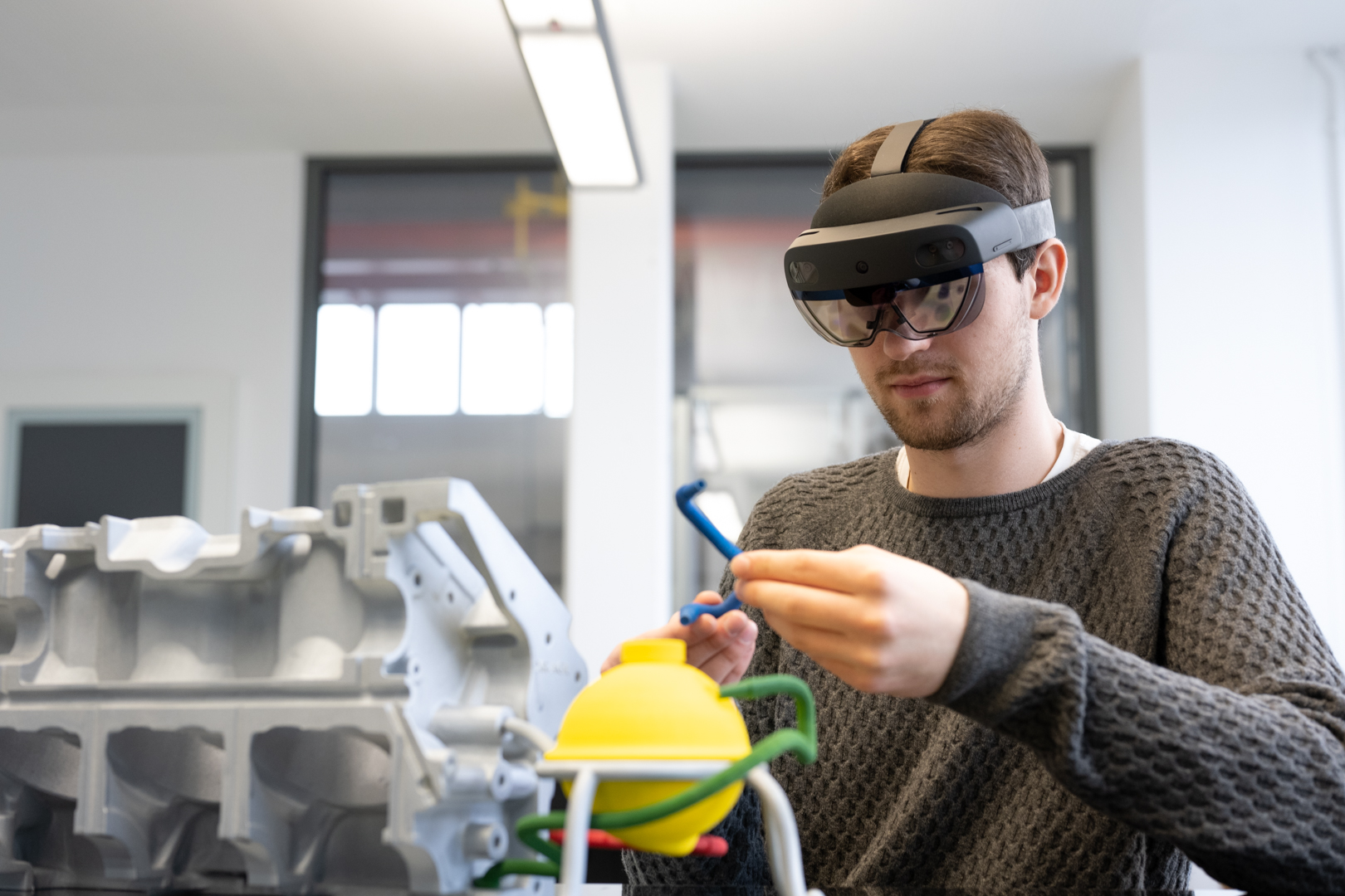 A man is wearing AR glasses.
