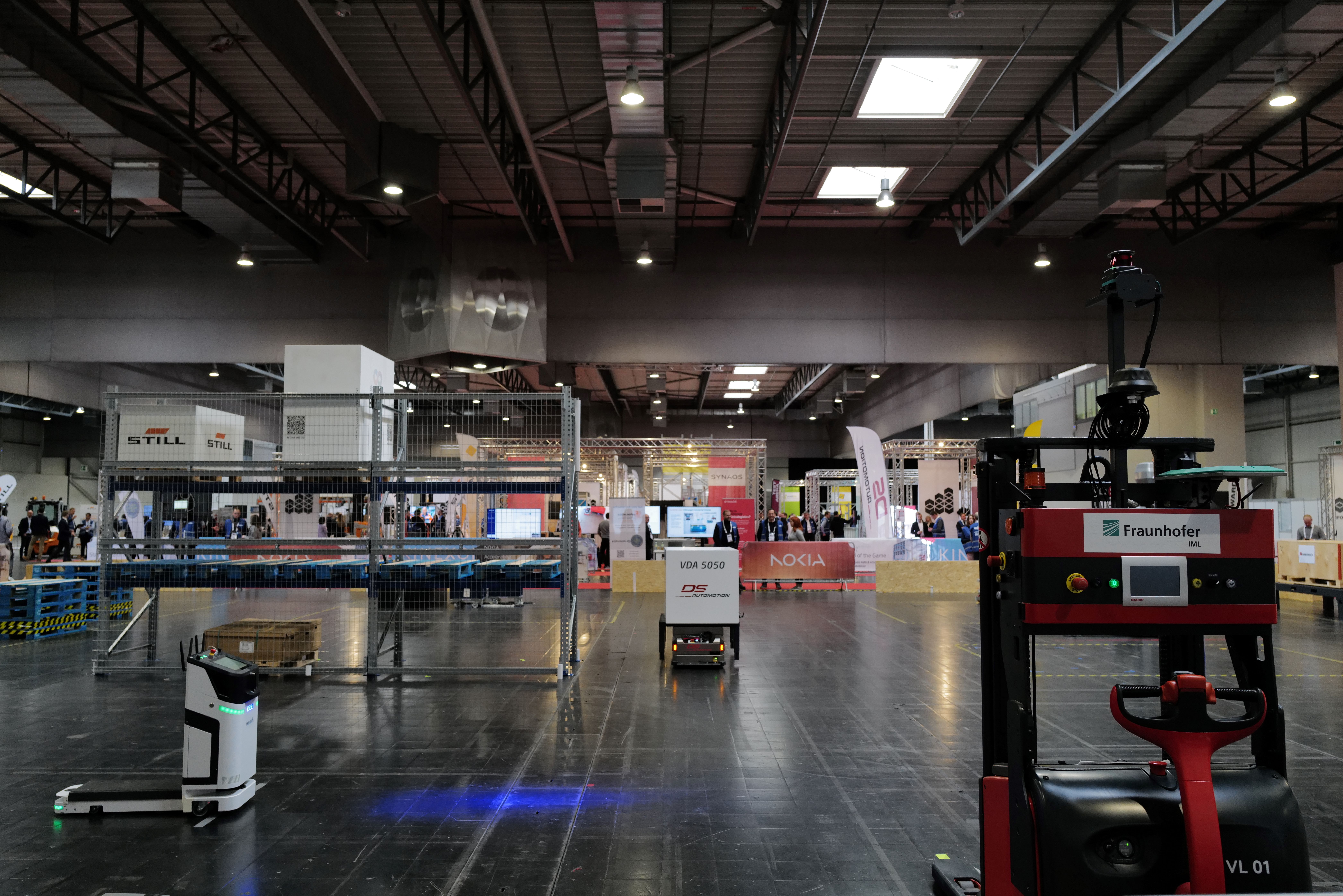 A logistics hall with different Automated Guided Vehicles